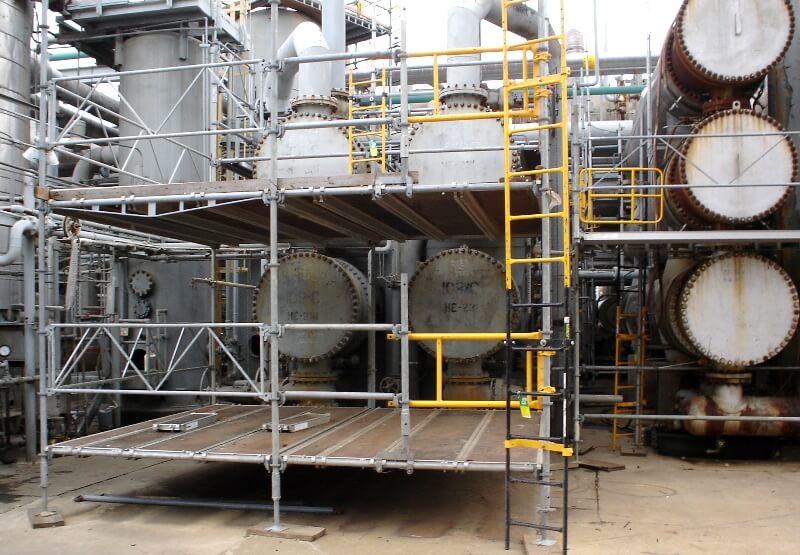 Industrial Scaffolding from Scaffolding Solutions is seen set up to provide access to tanks in a factory.