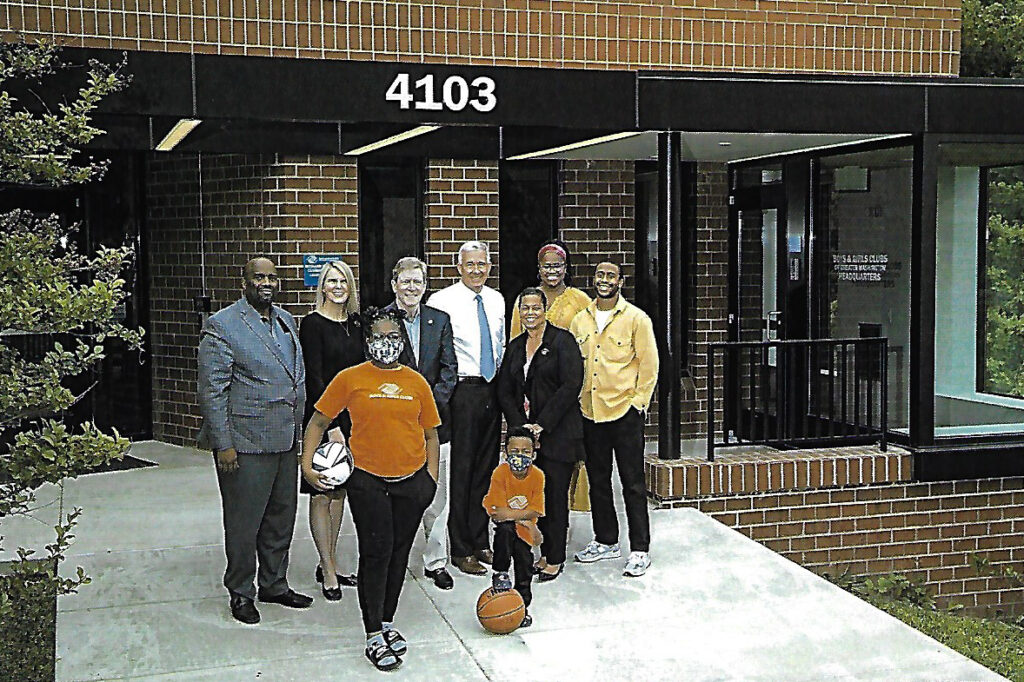 The leadership and two children in front of the newly renovated Headquarters of the Boys and Girls Clubs of Greater Washington