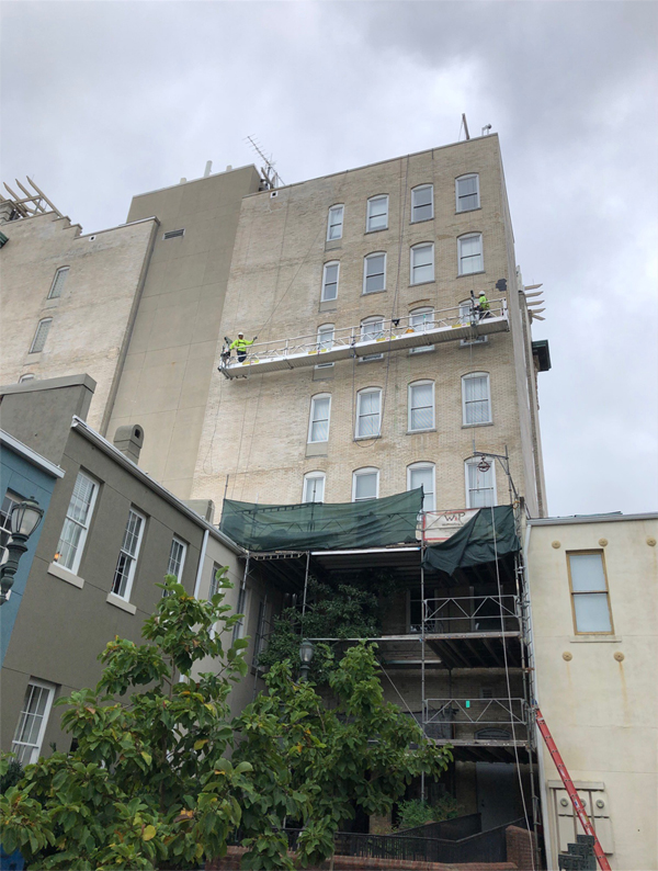 swing stage scaffolding for building repair.