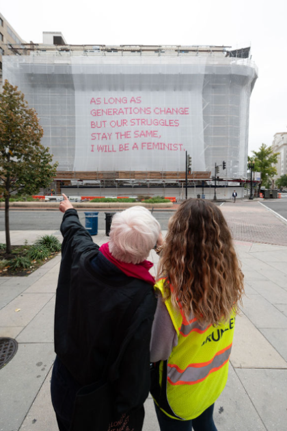 Museum and Scaffolding Solutions team members working together to ensure the custom netting is placed correctly.